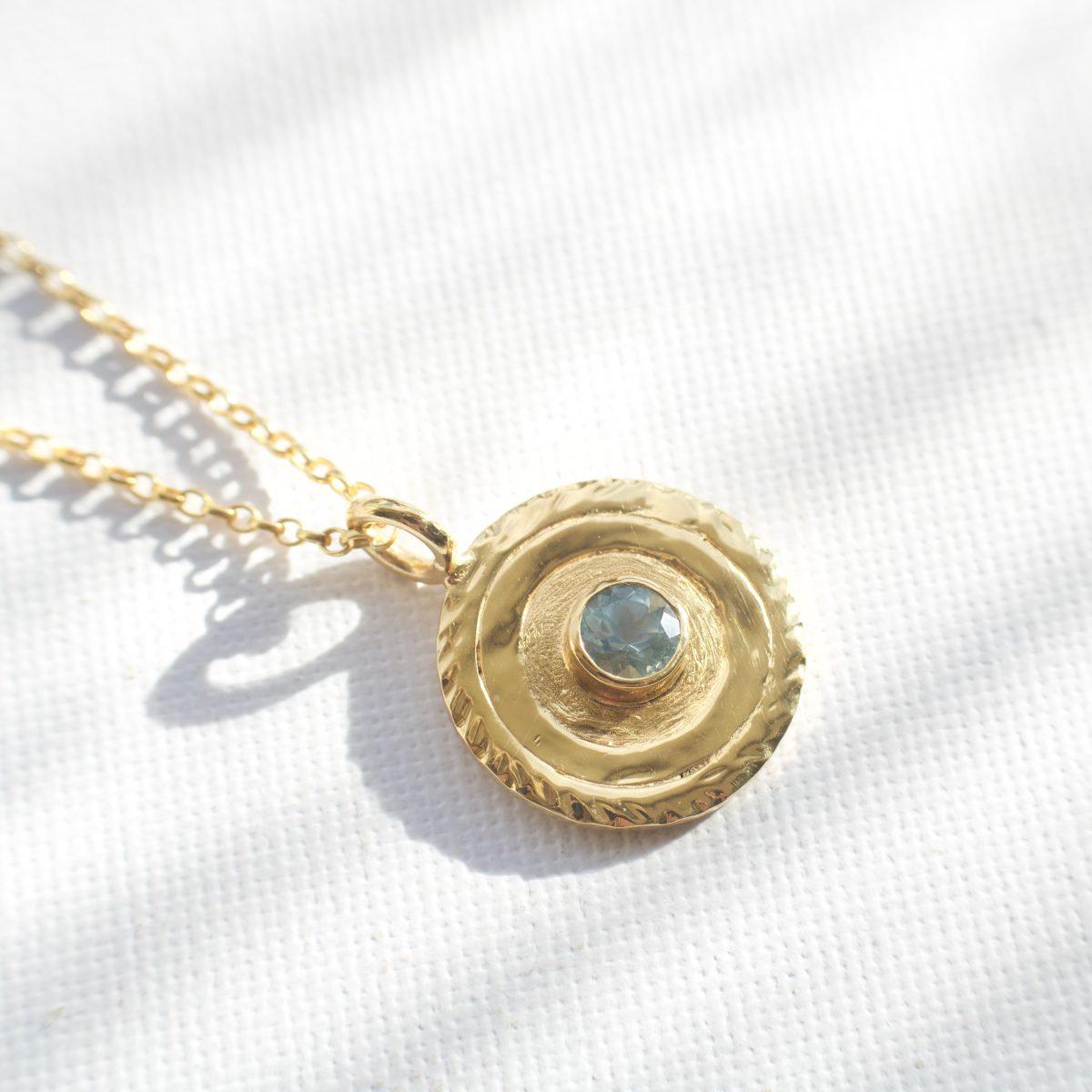 Skye 'Fairy Pool' gold circle necklace with aquamarine