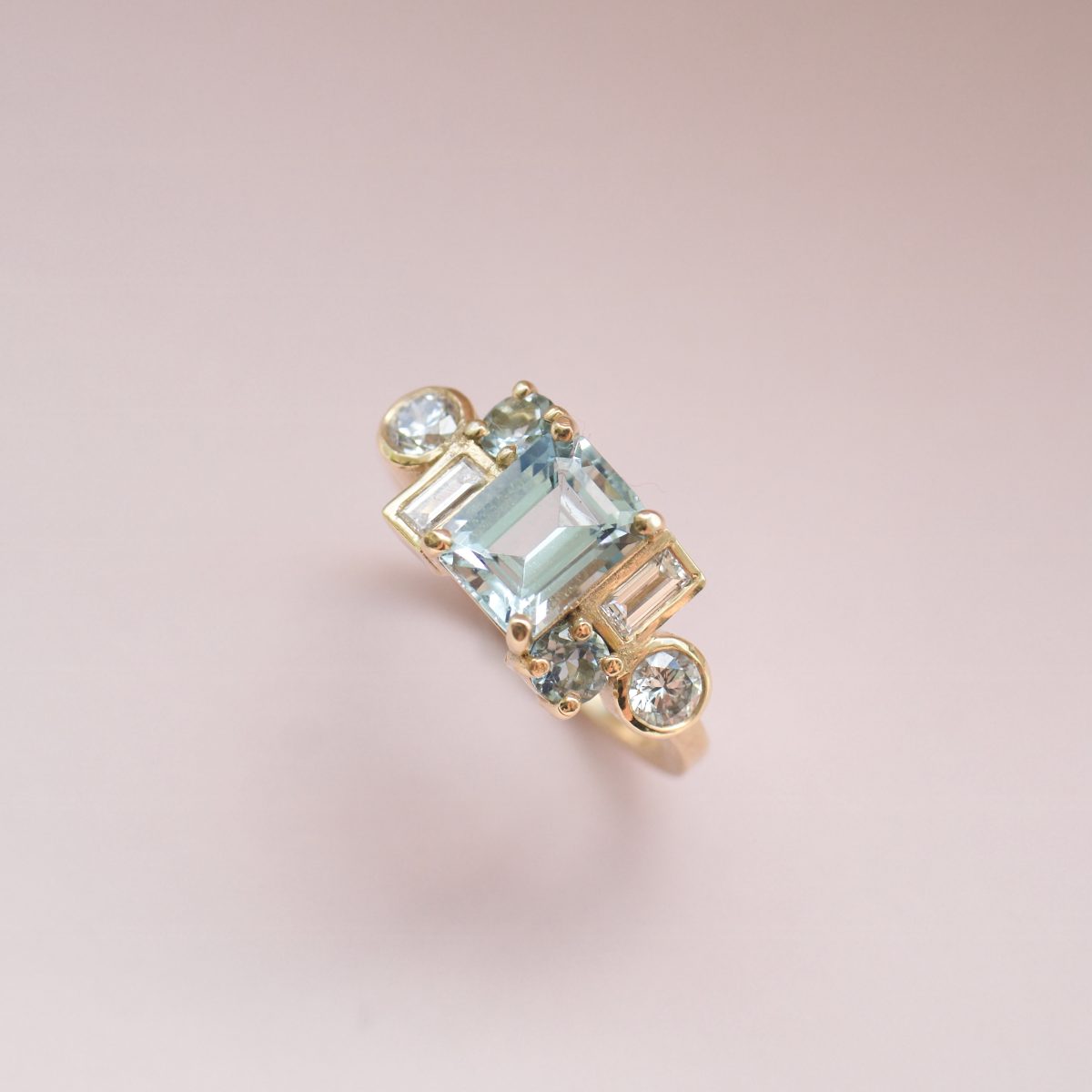 Geometric aquamarine and diamond cluster ring