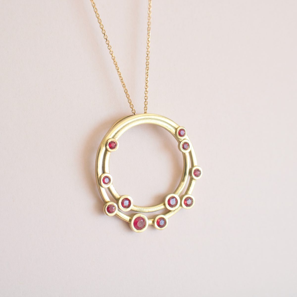 Multi circle gold pendant necklace with dainty rubies